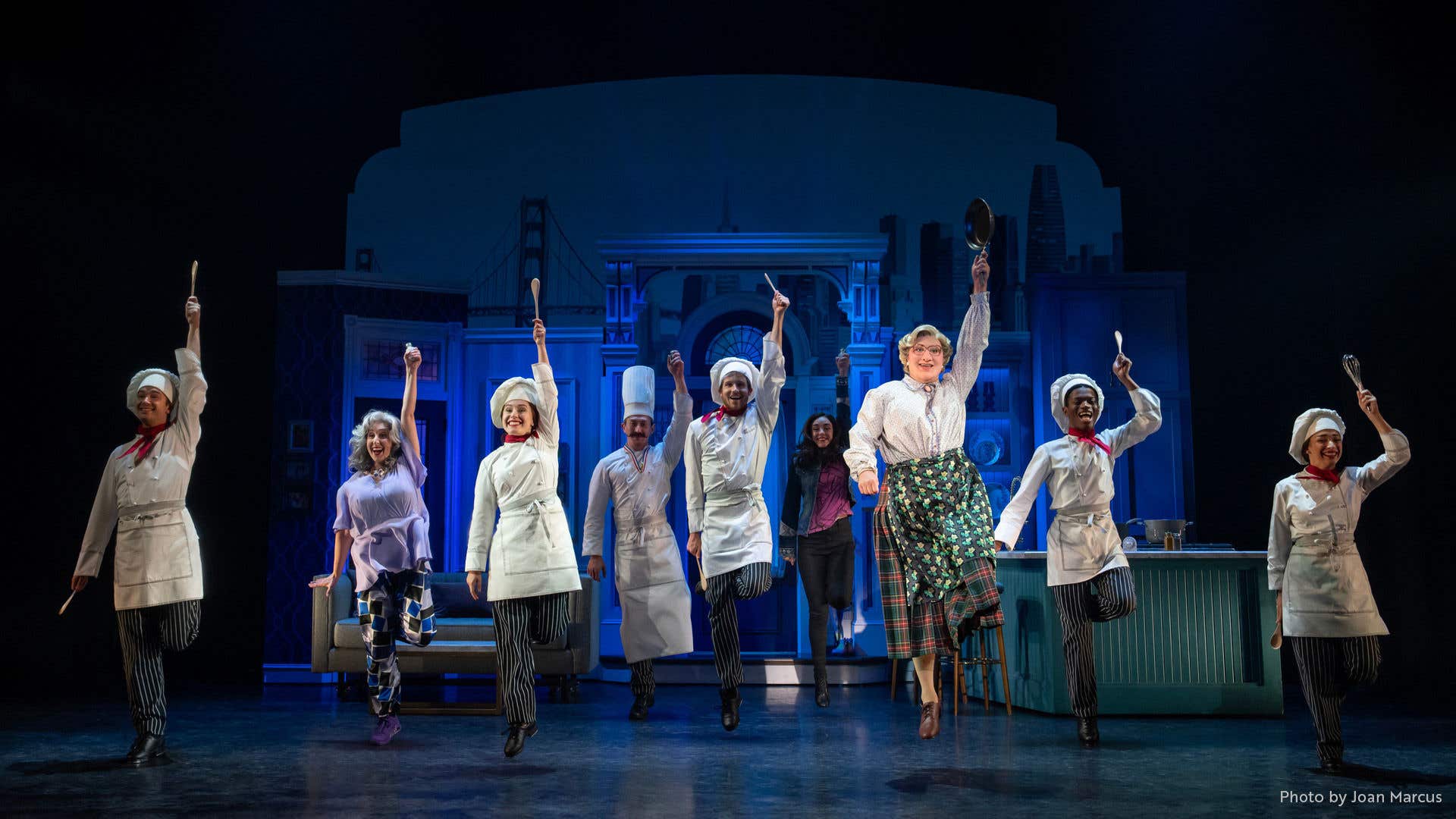 Mrs. Doubtfire and chefs performing a dance number on stage.